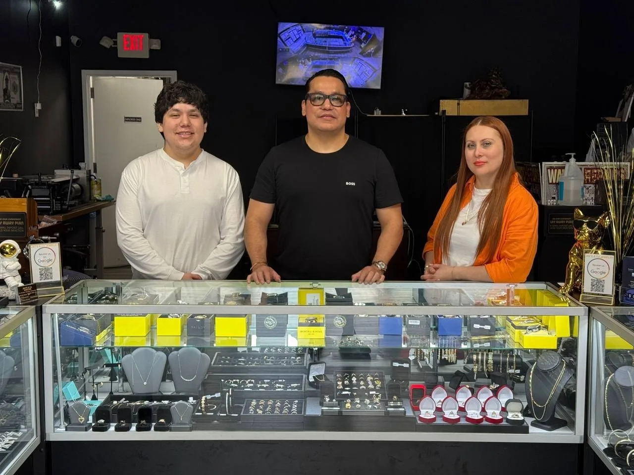 The Jav’s & Co Jewelry team behind the display counter at the Greensboro store